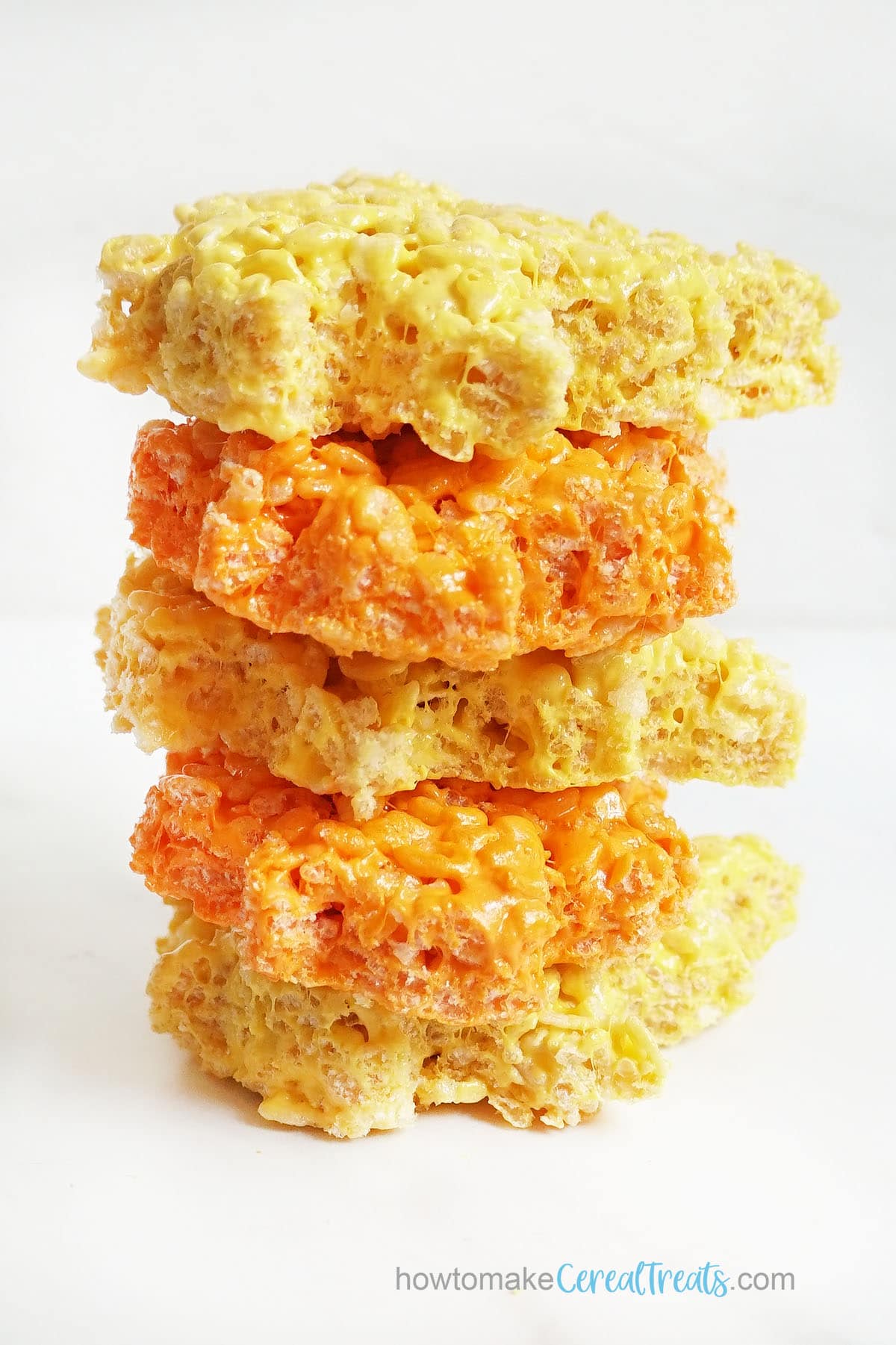 stack of yellow and orange Rice Krispie treats for fall