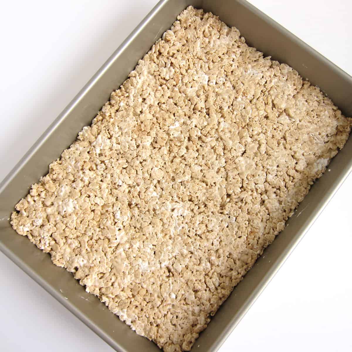 Fluffernutter Rice Krispie Treats spread into a 9x13-inch pan.