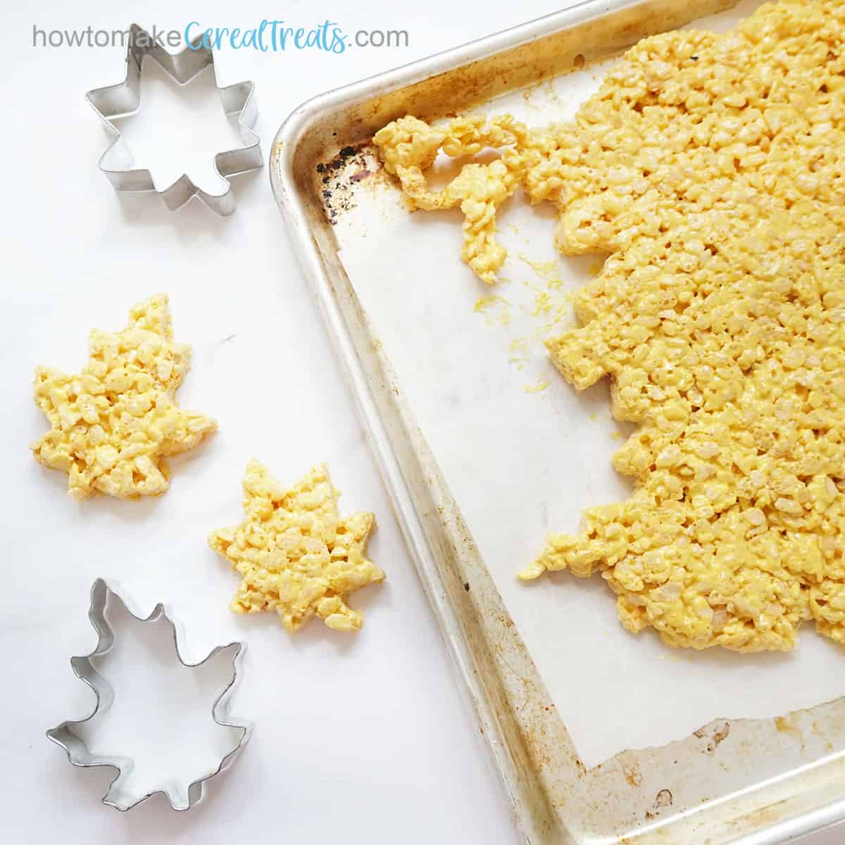 leaf cookie cutters cutting shapes from yellow Rice Krispie Treats