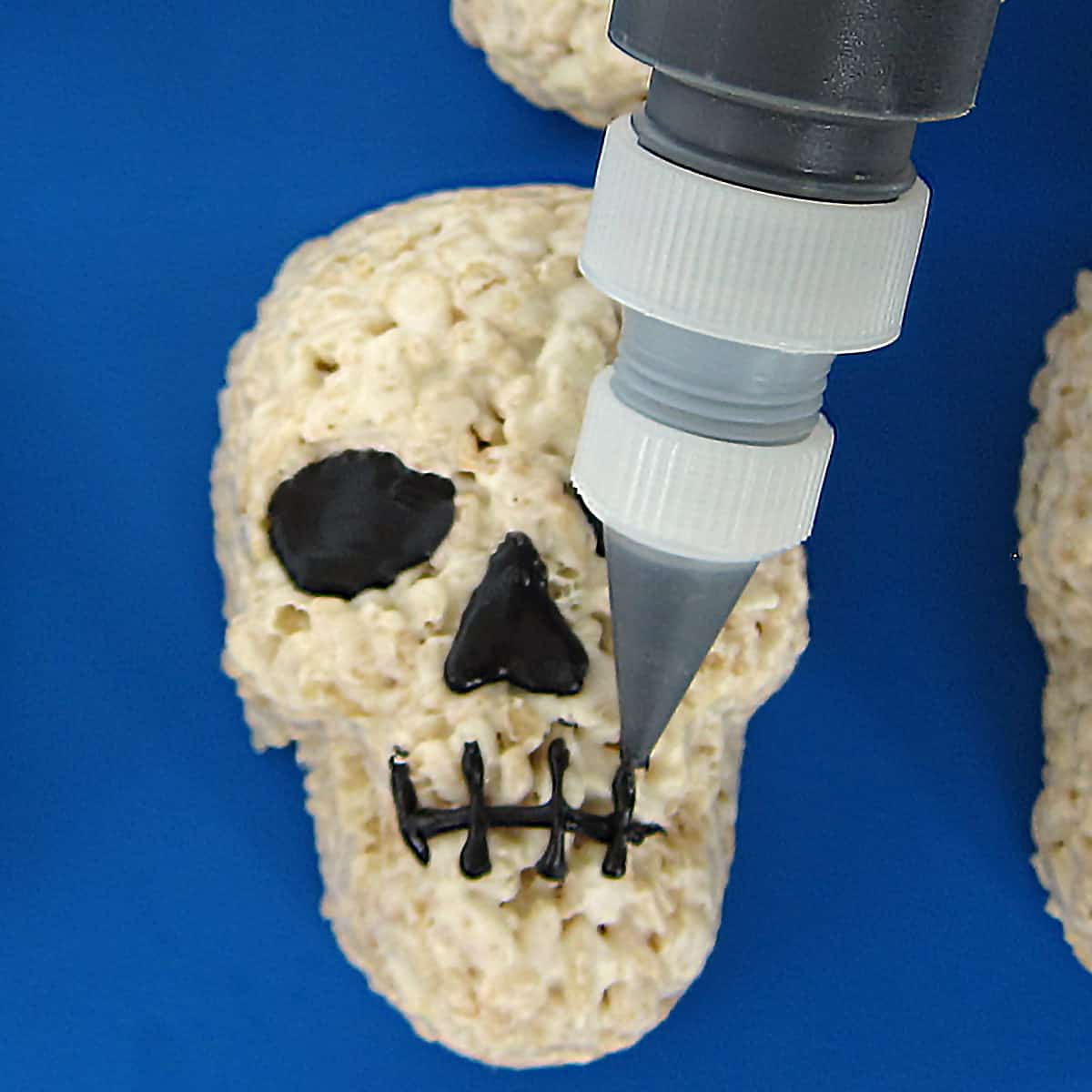 piping the skeleton's mouth.