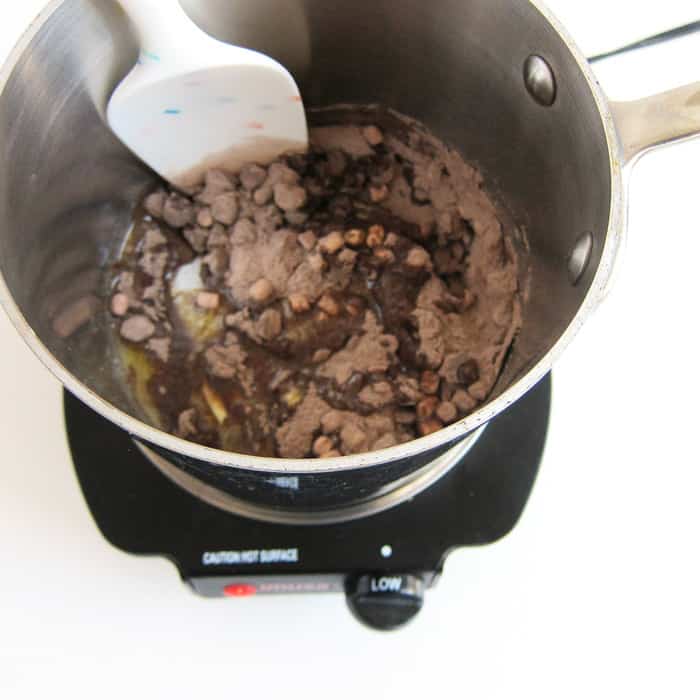 mixing melted butter, chocolate chips, and hot chocolate mix in a medium saucepan.