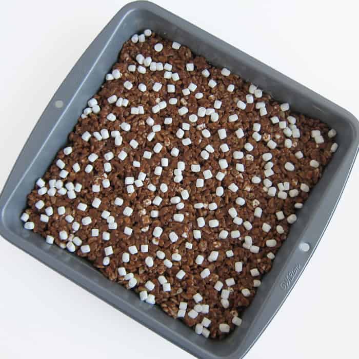 hot chocolate rice krispie treats in a square baking pan.