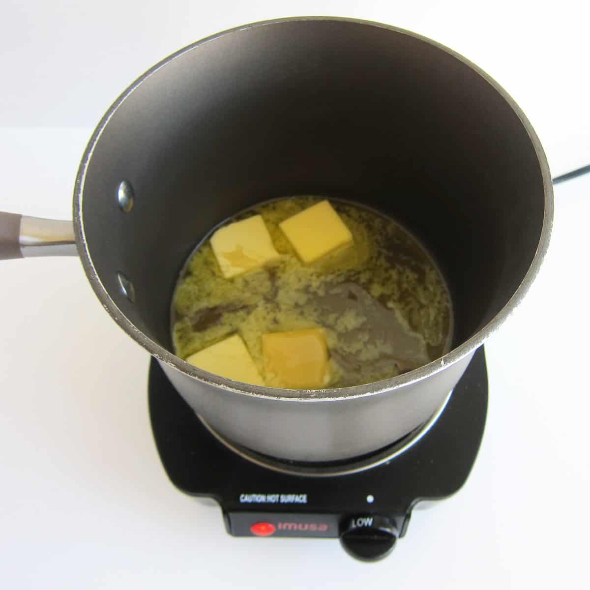 melting butter and honey in a saucepan over low heat.