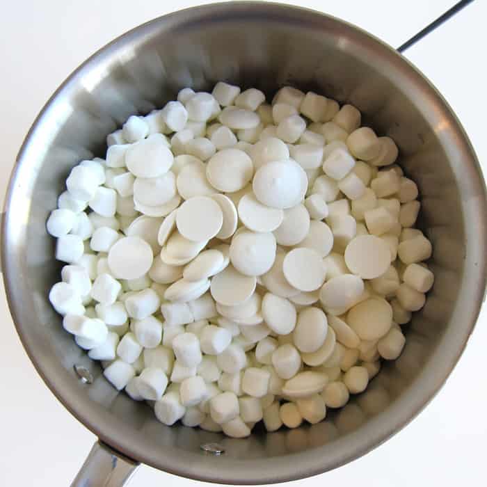 saucepan with mini marshmallows and white candy melts.