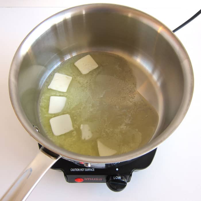 butter melting in saucepan over low heat.