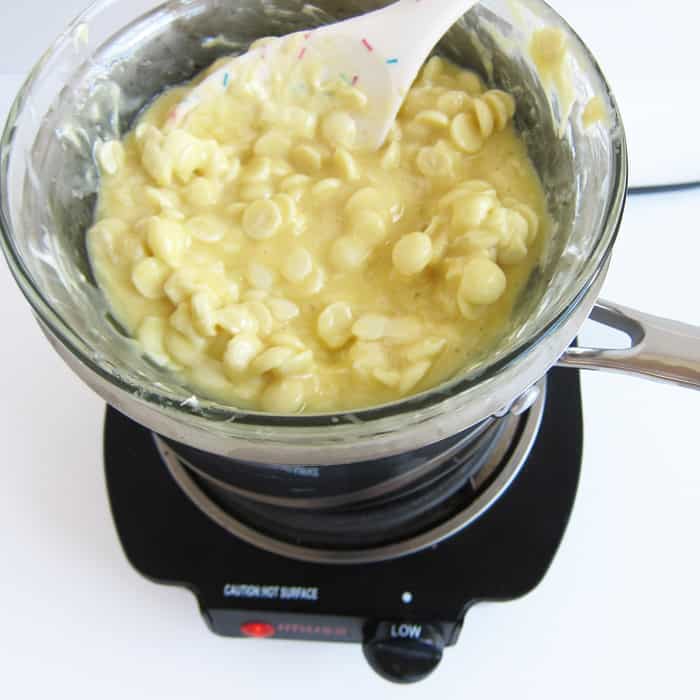 melting white chocolate and eggnog in a double boiler.