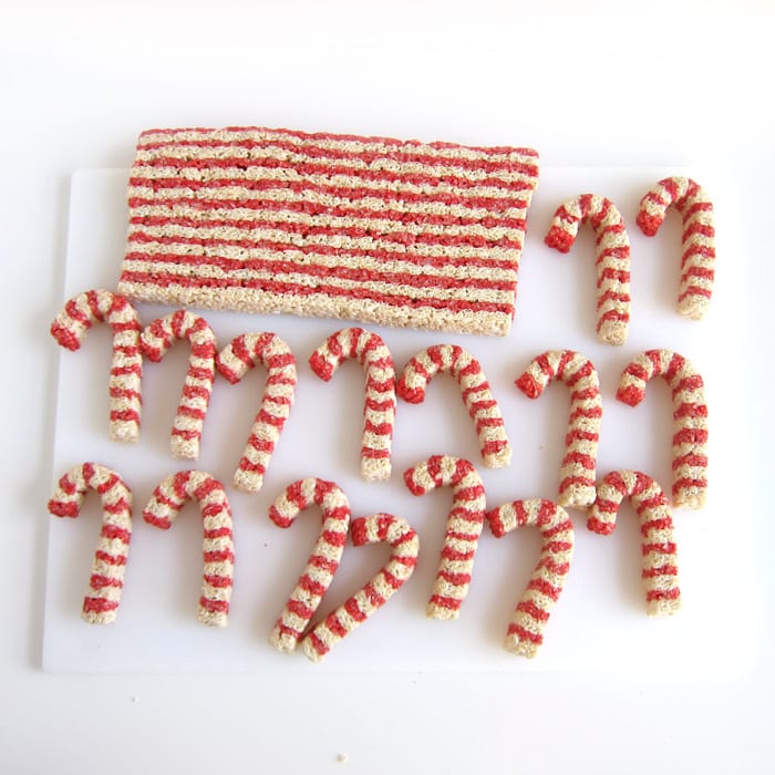 shaping red and white striped candy cane Rice Krispie Treats.